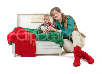 Baby boy in old box with his mother