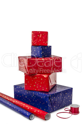 Stack of five Presents and wrapping Paper