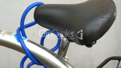 A bikes seat with a blue cord or whire GH4 4K