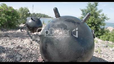 Two big sea mines from the old war placed on the ground GH4 4K UHD
