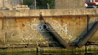 Stone wall of the pontoon harbour with yachts and ships on dock GH4 4K