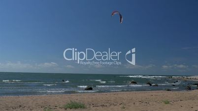 An adventurer doing great stunts on the sea using water surfing GH4 4K