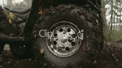 The muddy left wheel of the offroad vehicle FS700 4K