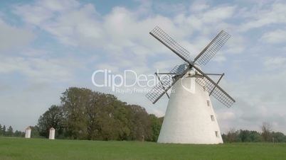 A classic old windmill in the middle of the field FS700 4K