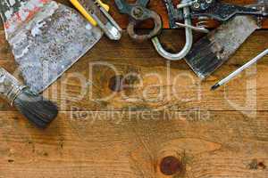 Various old diy tools on rustic work bench