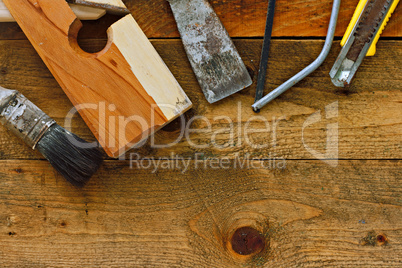Various old diy tools on rustic wooden work bench