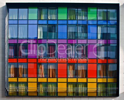 Multi-colored modern apartment building windows