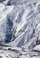 Speed flying in snow mountains at sun day