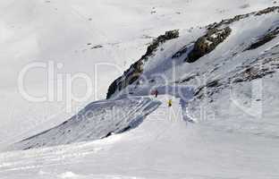 Snowboarders and skiers on ski slope