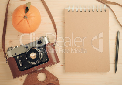 retro camera on wooden table