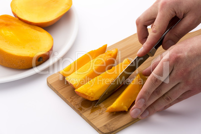 Knife Finished Cutting Off A Fourth Mango Chip