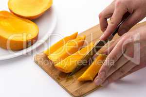 Knife Finished Cutting Off A Fourth Mango Chip