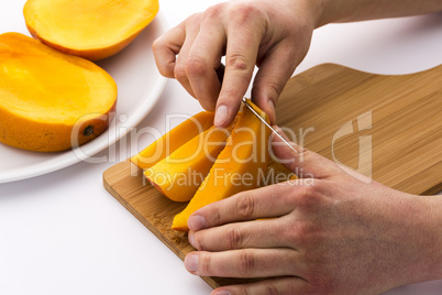Peeling Away The Mango Skin From A Fruit Chip