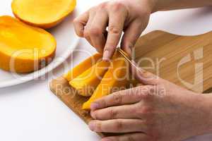 Peeling Away The Mango Skin From A Fruit Chip