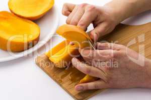 Two Male Hands Peeling A Juicy Mango Fruit Chip
