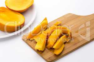 Mango Fruit Pulp And Its Peel On A Cutting Board