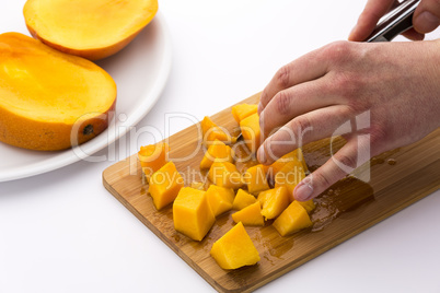 Juicy Mango Fruit Pulp Diced On A Kitchen Board