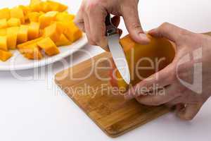 Peeling The Middle Mango Slice With The Fruit Pit