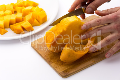 Middle Third Of A Mango With Its Pit Being Peeled