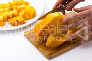 Middle Third Of A Mango With Its Pit Being Peeled