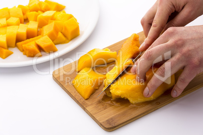 Cutting Juicy Fruit Pulp Around A Mango Pit