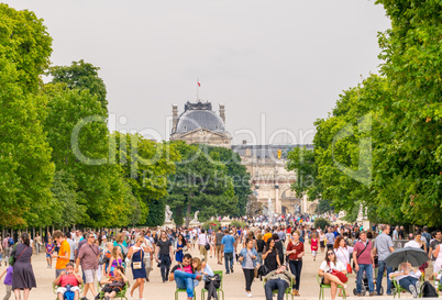 PARIS - JULY 20, 2014: Tourists walk along Tuileries Gardens in