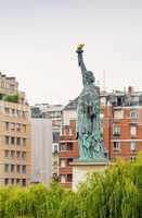 The Statue of Liberty in the middle of Paris cityscape