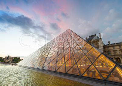 PARIS - JUNE 15 : Louvre museum at twilight in summer on June 15