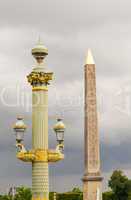 Obelisk in Place de la Concorde against cloudy sky - Paris