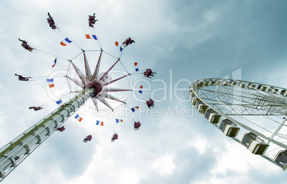 Amusement park against cloudy sky