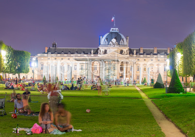 Tourists in Champs de Mars on a wonderful summer night