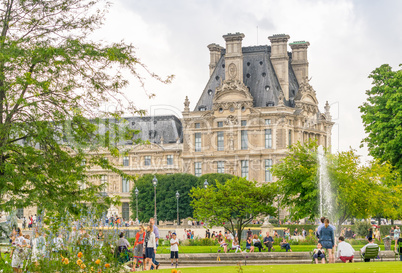 PARIS - JULY 20, 2014: Tourists walk along Tuileries Gardens in