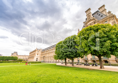 PARIS - JUNE 15, 2014: Tourists in Tuileries Gardens on a summer