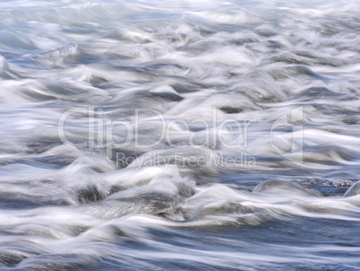 Strand mit Lavasteinen