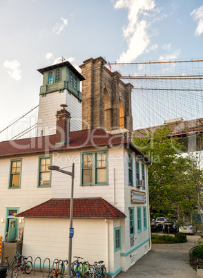 Brooklyn Bridge as seen from Brooklyn streets at sunset time