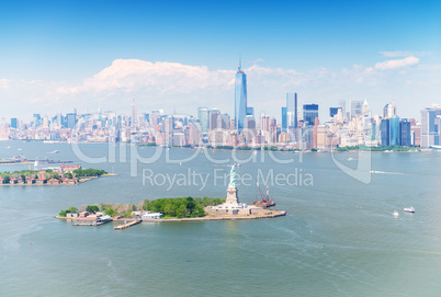 Stunning Manhattan aerial panorama with Statue of Liberty on for