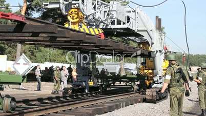 Soldiers and Railroad track installation machine.