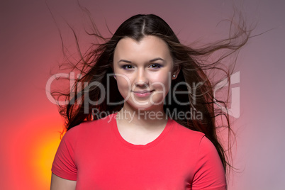 Photo of the teenage girl with blowing hair