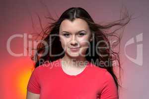 Photo of the teenage girl with blowing hair