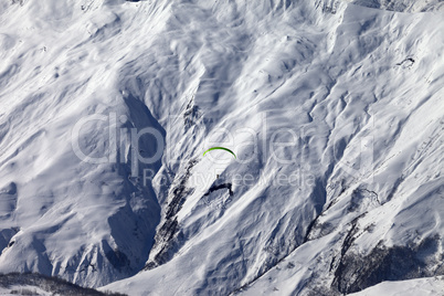 Speed riding in winter mountains at sun day