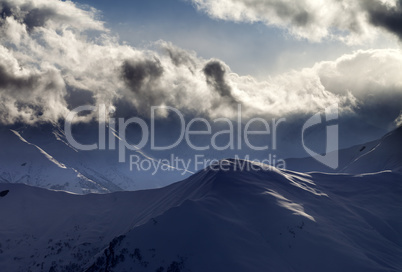 Evening mountain and sunlight clouds