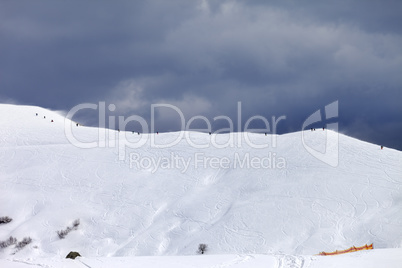 Off-piste slope and gray sky in bad weather day