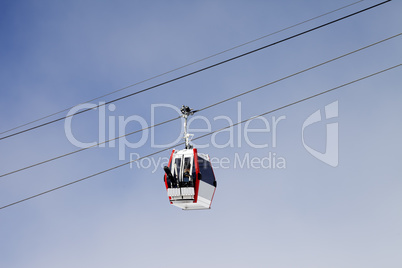 Gondola lift with ski and snowboards