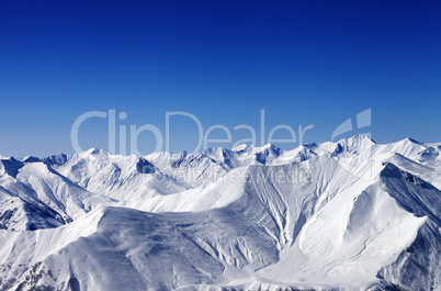 Winter snowy mountains with avalanche slope