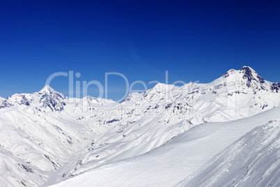 Snowy mountain peaks in sun nice day