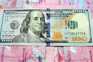 American dollars on the grivnas banknotes' background