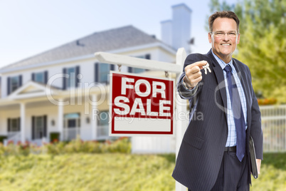 Agent with Keys in Front of Sale Sign and House