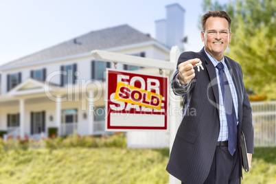 Agent with Keys in Front of Sold Sign and House