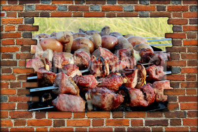 appetizing barbecue on the fire behind the broken wall