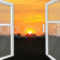 window opened to the bright sunset